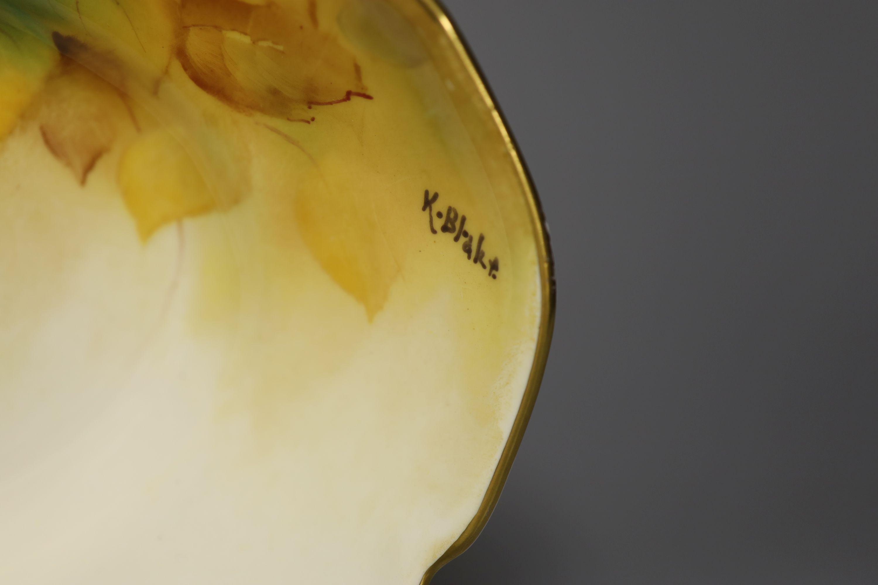 A Royal Worcester oval dish painted with autumnal leaves and berries by Kitty Blake, signed, date mark 1933